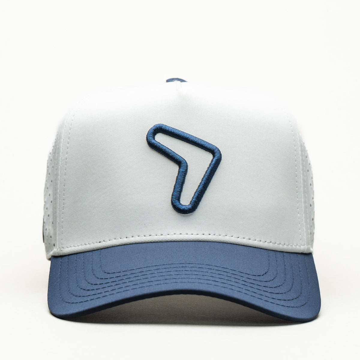 Kids Booma hat in white with blue brim and blue boomerang logo